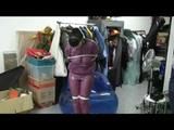Video with Jill tied and gagged in a shiny purple semi transparent PVC suit