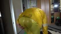 Pia wearing sexy yellow shiny nylon rainwear cleaning up the studio (Video)