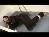 Watch Maggy beeing bound and gagged in a bathtube wearing a shiny nylon Skisuit from our Archives 2012