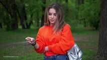 Pretty Kate is smoking Marlboro Red 100s in the park