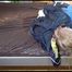 Mara tied and gagged with ropes on bed wearing a lightblue oldschool shiny nylon shorts and an oldschool lightblue/blue rain jacket (Video)