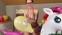 nail2pop promotional balloons on inflatable unicorn and destroying it with a pen