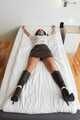 Spread eagle on bed