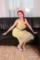 Morrigan - posing in yellow trash bag dress