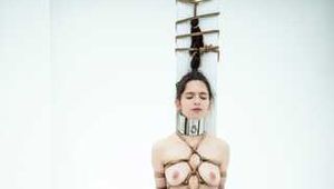 Kinbaku waitress in shiny metal