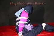 Watching Pia wearing blue/pink shiny nylon rainwear being tied and gagged and hooded with tape and a clothgag (Pics)