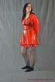Bound in PVC minidress and red raincoat