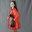 Bound in PVC minidress and red raincoat