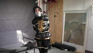 Rey bound and gagged in a shiny Downjacket and Leatherpants