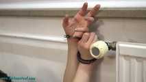 Vicky cuffed to the heater