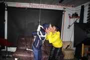 Sandra beeing tied and gagged by Stella in Shiny Nylon Rainwear crotchrope-suspended 