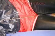 Mara ties and gagges herself with hand cuffs on a sofa wearing a supersexy black Leggings and a shiny nylon shorts and a rain jacket (Pics)