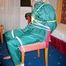 Blonde archive girl tied and gagged in an green shiny nylon rainsuit on a chair (Pics)