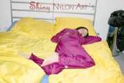 ENNI wearing a sexy purple shiny nylon rain suit lying in bed with yellow shiny nylon cloths lolling and posing (Pics)