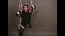 4 short videos in one of an beautiful black haired archive girl tied and gagged on the floor wearing sexy shiny nylon rainwear (Video)