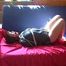Archive girl tied and gagged on a sofa wearing a shiny nylon shorts and a shiny rainjacket (Video)