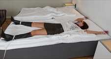 Spread eagle on bed