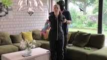 Rachel Adams bound and gagged by an Intruder in shiny Rainwear