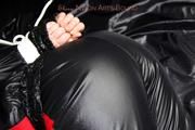 Jill bound and gagged in a shiny nylon skisuit