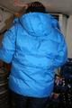 Jill posing in a cooling room wearing a shiny nylon rainpants and a down jacket (Pics)
