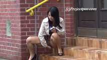 068016 Naughty Ling Takes A Long Arcing Pee From The Office Steps