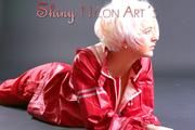 Blonde archive girl posing in a studio wearing a sexy red AGU rainwear combination (Pics)