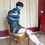 1162a Mia in Business wear Taped to a chair