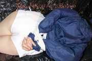 LUCY tied and gagged with ropes and a cloth gag wearing a supersexy white shiny nylon shorts and blue rain jacket (Pics)