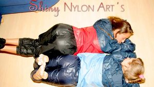 Stella and Leonie having fun with eachother wearing sexy shiny nylon rainwear (Pics)