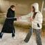 Blond-haired archive girl tied and gagged by another archive girl wearing shiny down jackets (Pics)