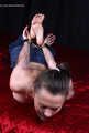 Tapegagged topless barefoot Peggy, hogcuffed with heavy steel cuffs
