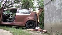 Mistress Jenna stands on the slave with a car while smoking in the slave's mouth B