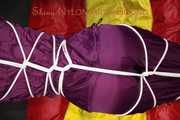 Watching sexy Sonja wearing a supersexy purple shiny nylon rainwear combination being tied and gagged overhead with ropes and a clothgag (Pics)