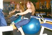 Stella and Leonie in a fitness studio wearing supersexy rainwear (Pics)