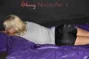 Watching Pia preparing her bed wearing a sexy black shiny nylon shorts and a grey tshirt (Pics)
