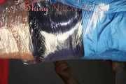 Watching sexy Pia being envelopped in film wearing a sexy blue shiny nylon shorts and a lightblue shiny nylon rainjacket (Pics)