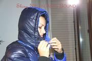 Lulu ties, gagges and hoodes herself on a bed with cuffs wearing a sexy black/blue shiny nylon down jacket and a darkblue rain pants (Pics)