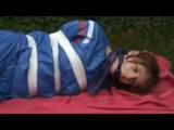 a video with Nicole tied and gagged in a shiny blue PVC suit