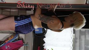 Watching sexy COURTNEY wearing a darkblue shiny nylon shorts and a top while preparing coffee and doing her housework (Pics)