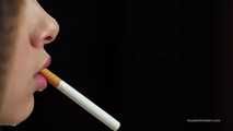 A young lady showing her smoking skills in a closeup video 