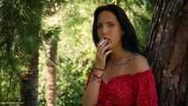 Elizaveta is smoking two all white cigs in a row