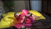 Get 2 Videos with Lucy bound and gagged in her shiny nylon Rainwear from our Archives
