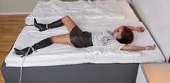 Spread eagle on bed