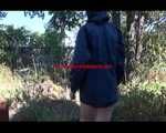 Mara wearing only a hot rain jacket and rubber boots lingering in the garden taking a shower (Video)