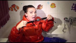 Jill ties and gagges herself in a bath tub for having an extraordinary experience wearing a sexy lightblue rainpants and an orange down jacket (Video)