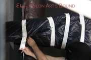 Watching sexy Sandra wearing a sexy pink shiny nylon rain pants and a shiny nylon pink down jacket being tucked in a down cover and tie and gagged and hooded with tape and a ballgag (Pics)