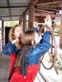two of our archive girls in shiny nylon rainwear and bondage