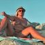 Smoking nude on the beach