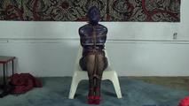 Ana in rubber raincoat backwards