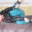 PIA ties and gagges herself with a bar and a cloth gag on a bed wearing a sexy green shiny nylon pants and a black rain jacket (Pics)
